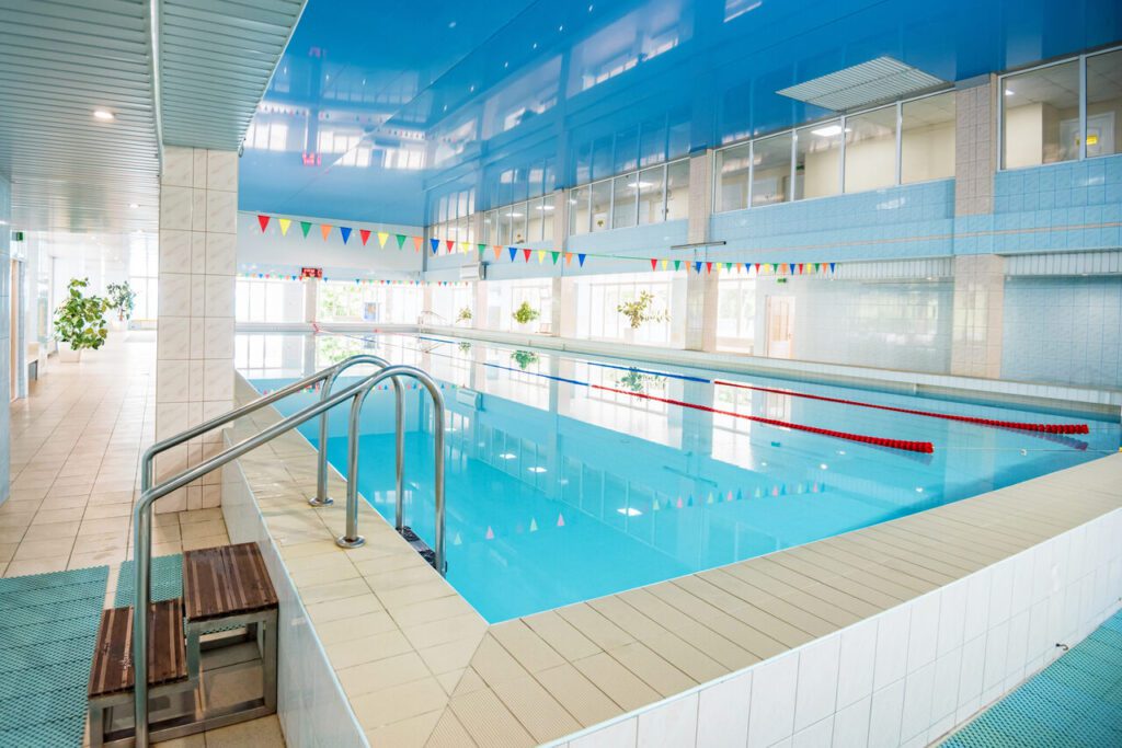 view of indoors swimming pool with metal ladder 2024 10 18 06 39 05 utc Easy Resize.com